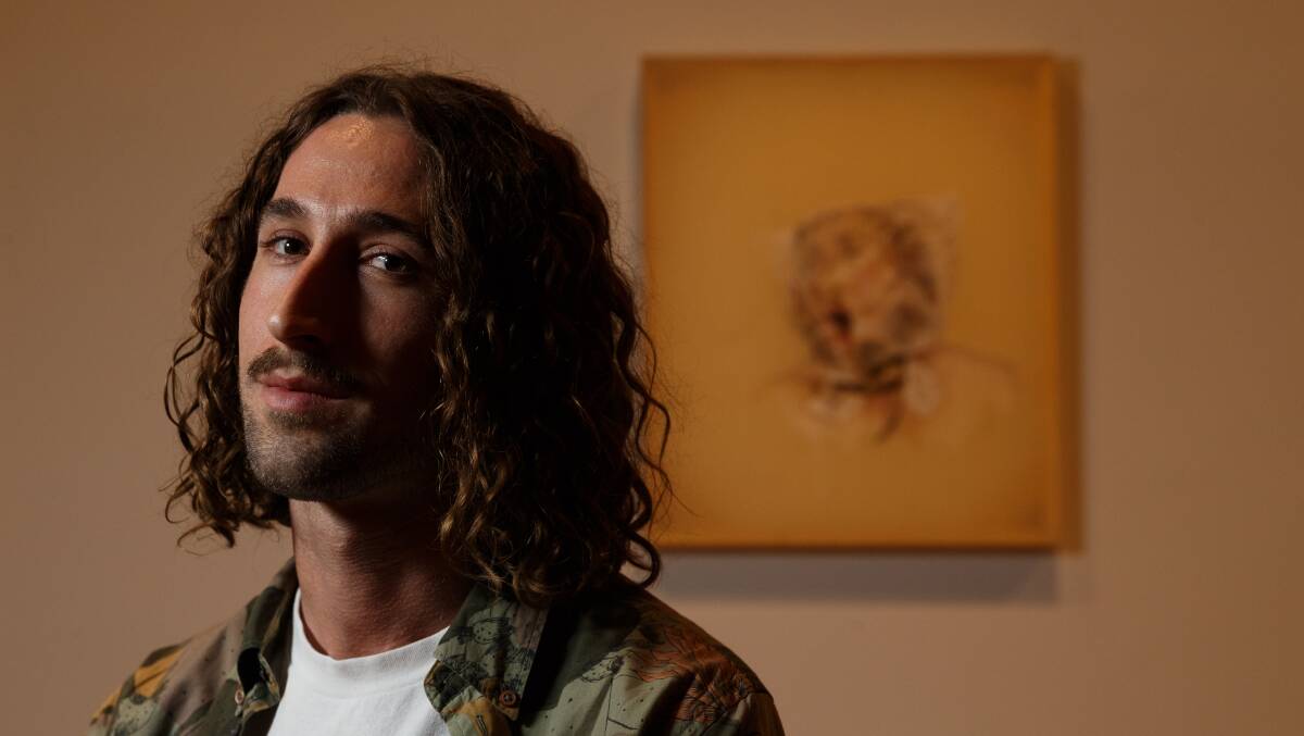 Confronting winner: Cameron Stead and his Kilgour Prize-winning artwork at Newcastle Art Gallery, Between You and Me. Stead collects $50,000 for the prize. Picture: Max Mason-Hubers