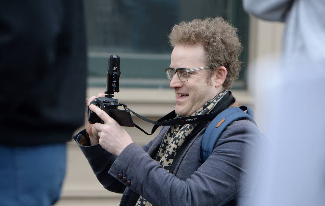 John Safran takes photographs at the first anti-mosque rally in Bendigo in August 2015. He has written a book about his experiences with extremism in Australia.