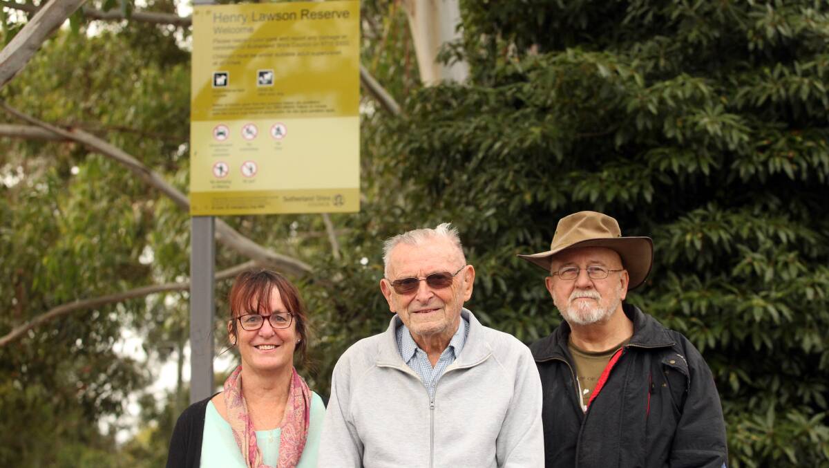 Happy birthday, Henry: Bob Walshe, centre, with members of the Como Henry Lawson Appreciation Group, Jenny Watson and Chris Sim at Henry Lawson Reserve, Como. Picture: Chris Lane