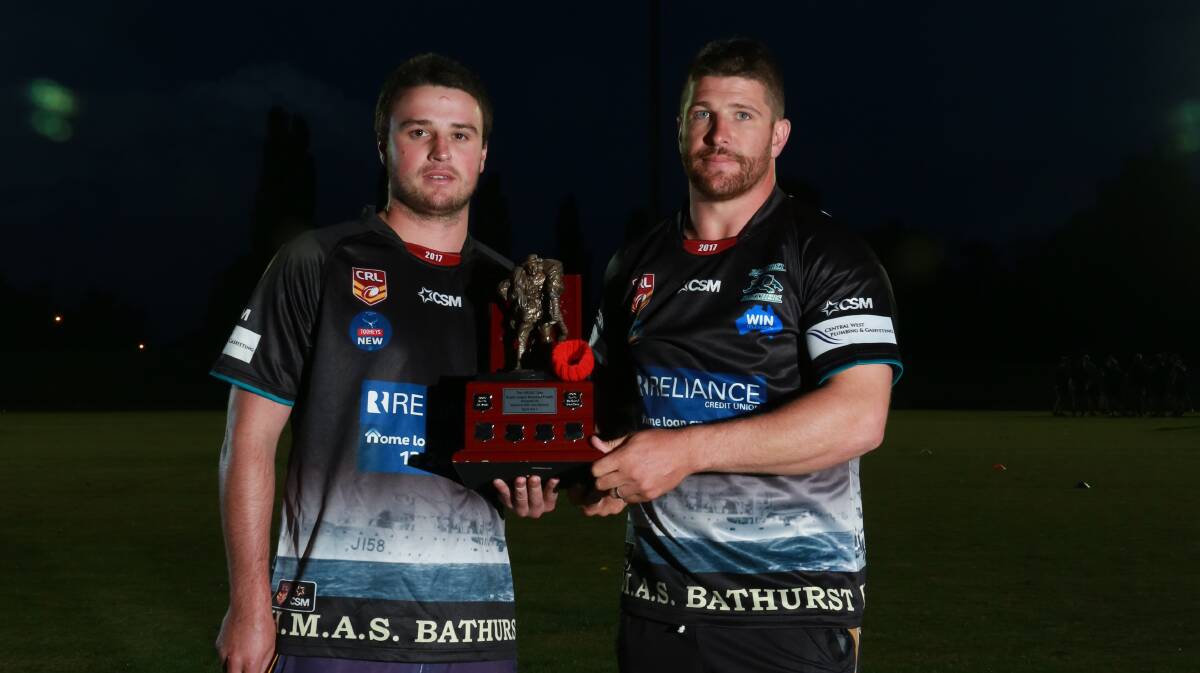 UP FOR GRABS: Jake Betts and Todd Barrow with the Anzac trophy both Bathurst clubs play for. 