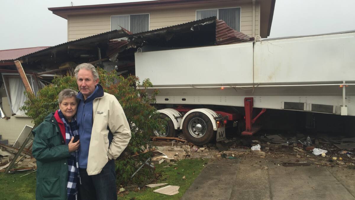 Sandra and Dale Mountney outside their Scottsdale home, which was crashed into by a truck on Monday morning. Picture: Toli Papadopoulos 