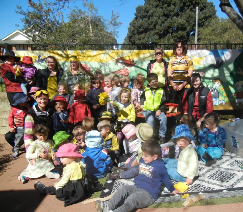  Children and Staff at Grenfell Preschool and Long Day Care celebrating Daffodil Day. 