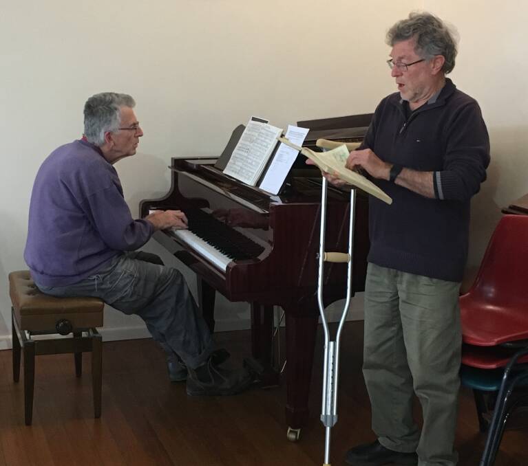 Joe Kinsela and John Willems warm up for the concert.




