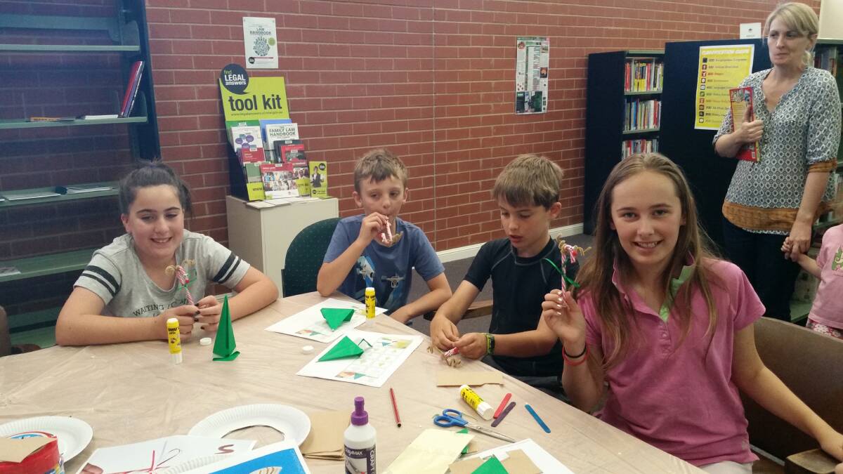 Children having a creative time at last weekend's 'Library arts and crafts'. Photo E Kearnes.