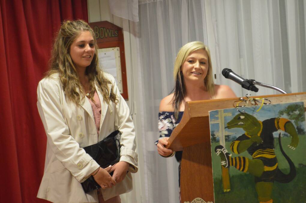 LEAGUE TAG: Caitlin Dixon (L) - Best defensive player and Alicia White address the crowd. 