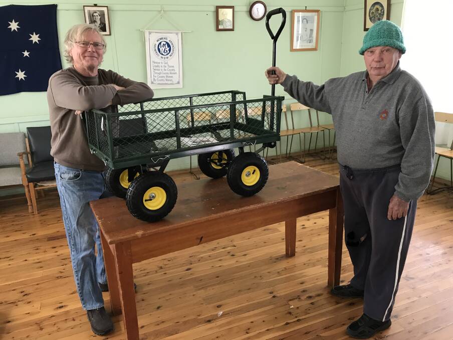 Steve Doney and Allan Brien assembled this great cart to donate to the Macey's Springtime Ball fundraiser. (C)
