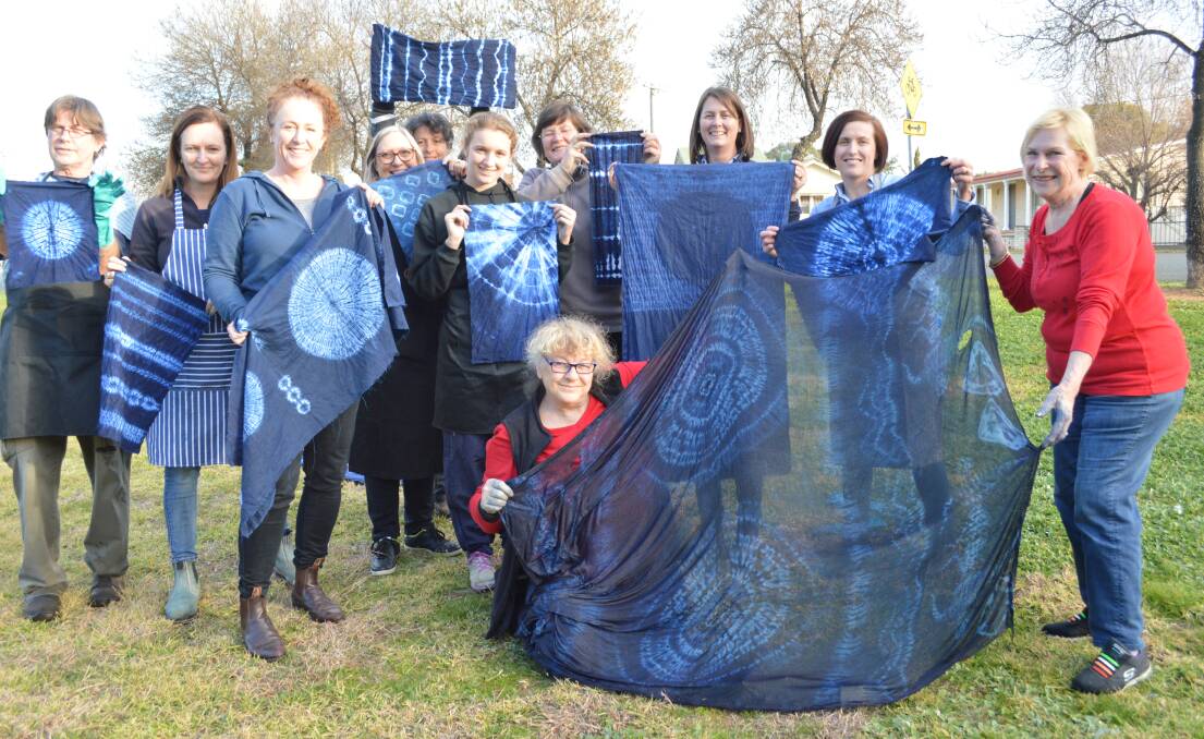 Japanese Shibori Indigo Dyeing: Dye-ing to show off the results of the day's work, with their teacher, Maureen Locke-Maclean (Far right in Red) are the Shibori group.