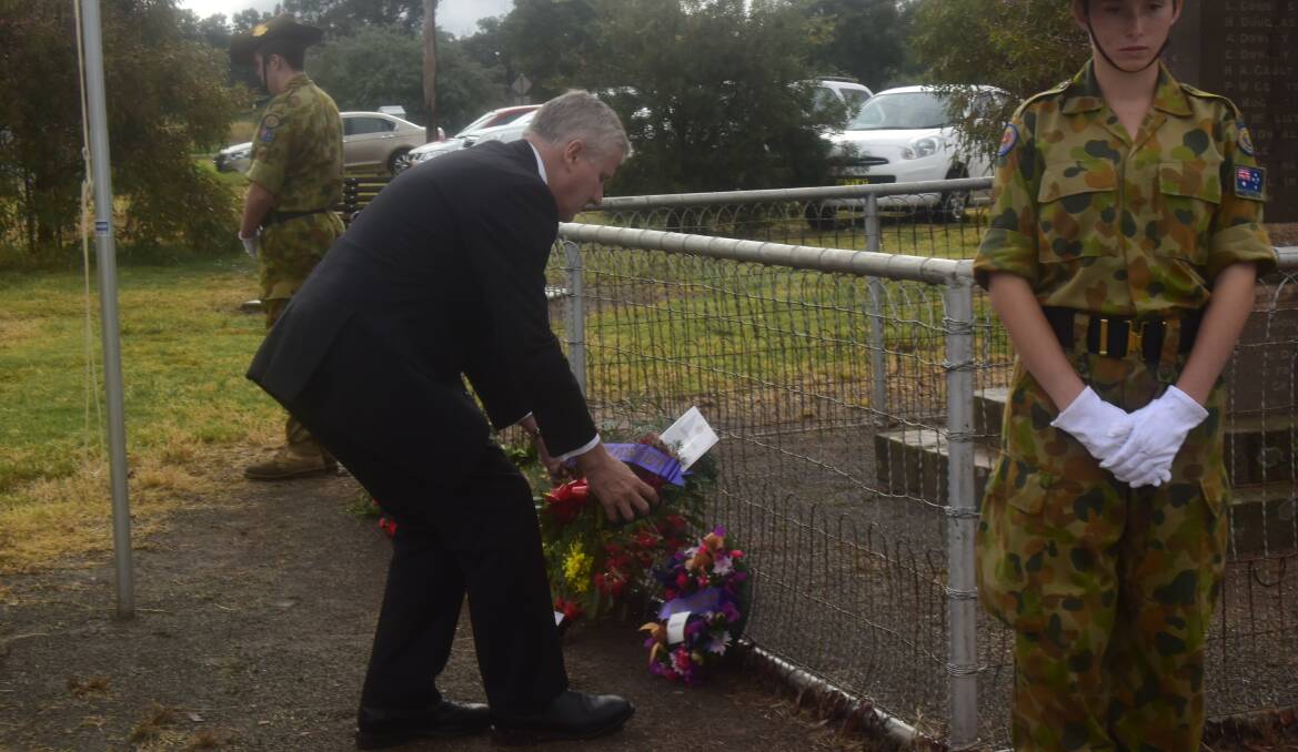 Member for Riverina Michael McCormack lays a wreath at the Bimbi Anzac Day Service.