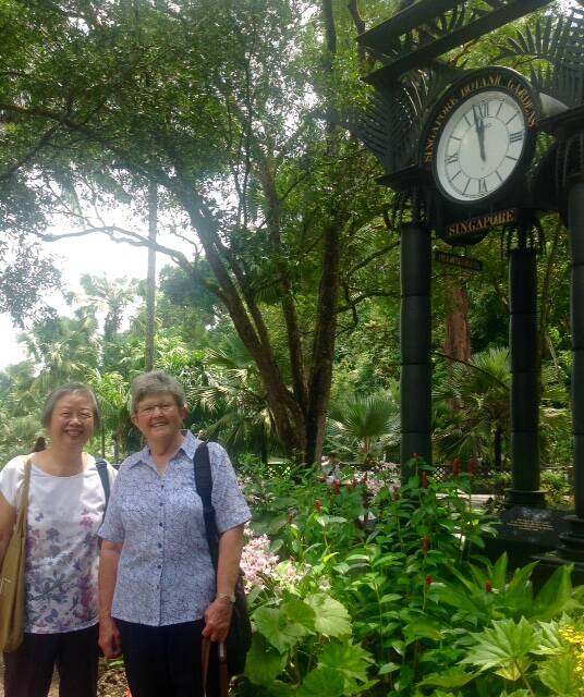 Jill Hodgson (R) with Dr Evelyn Cheng - friends of 55 years in Singapore Botanic Gardens. (Contributed)