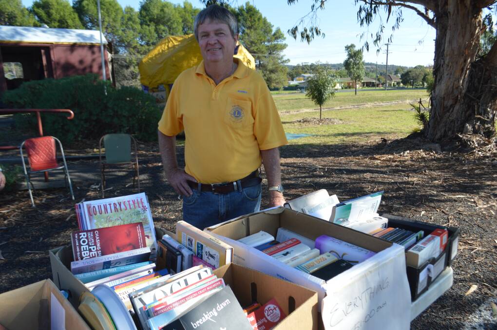 Lion Rodney O'Neill mans the bookstall at the Lions Market Day.
