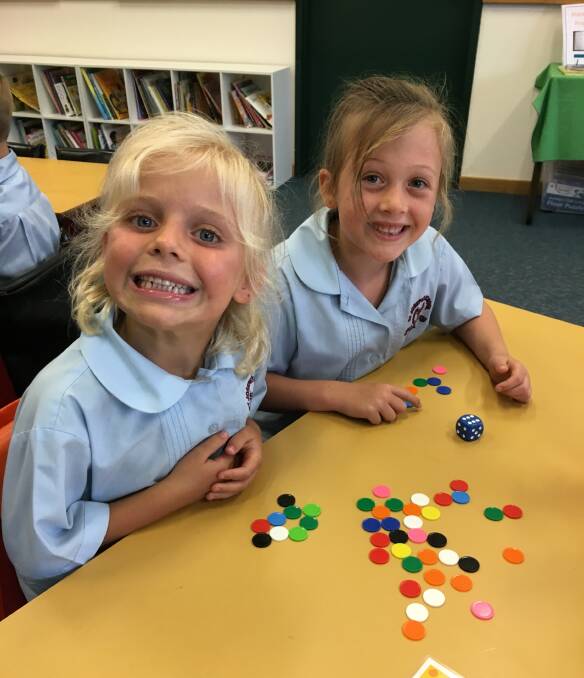 Lily Norrie and Darcey Biddle playing counting games.


