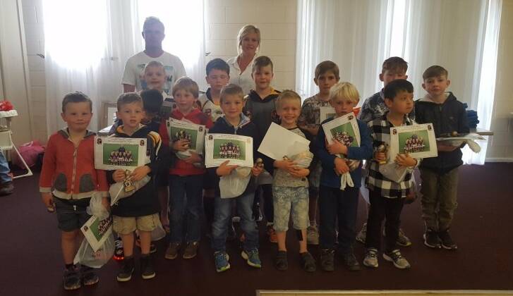 The U8s side with their coaches Adam and Somara Donelly. Photo GJRLFC.