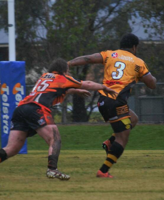 Amenaysai Aditagane fights off the opposition during last weekend's muddy clash against Canowindra.