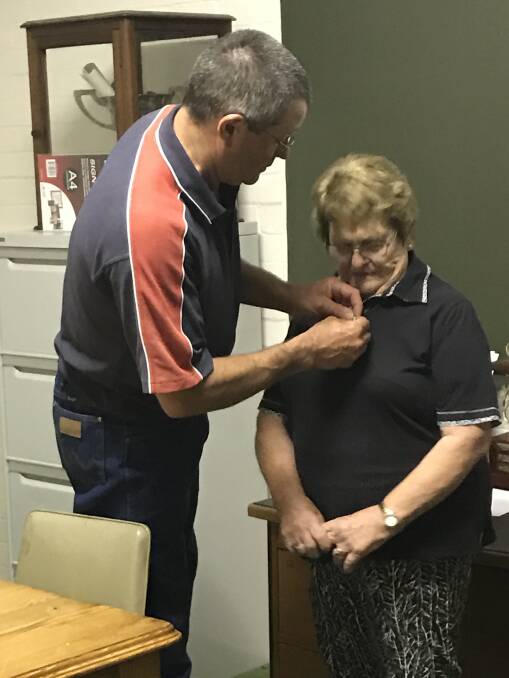 CONGRATULATIONS: Joan Eppelstun receives her life membership pin from Show Society President Peter Brown.