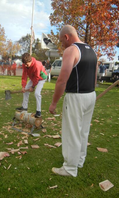 Local axeman Matt Reid and his son Billie participating in the festival woodchop. 