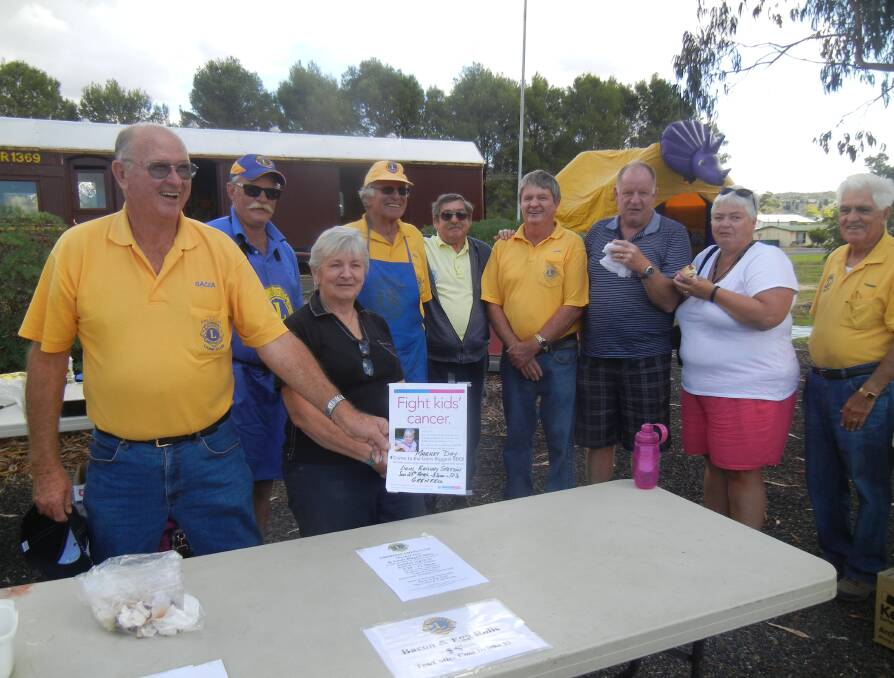 Barry Franklin, Chris Moran, Lain Thiel, Rod Harveyson, Dave Thiel, Rodney O'Neill, Phillip and Verlie Norris from Devenport and Terry Carroll at the Lions Biggest BBQ.