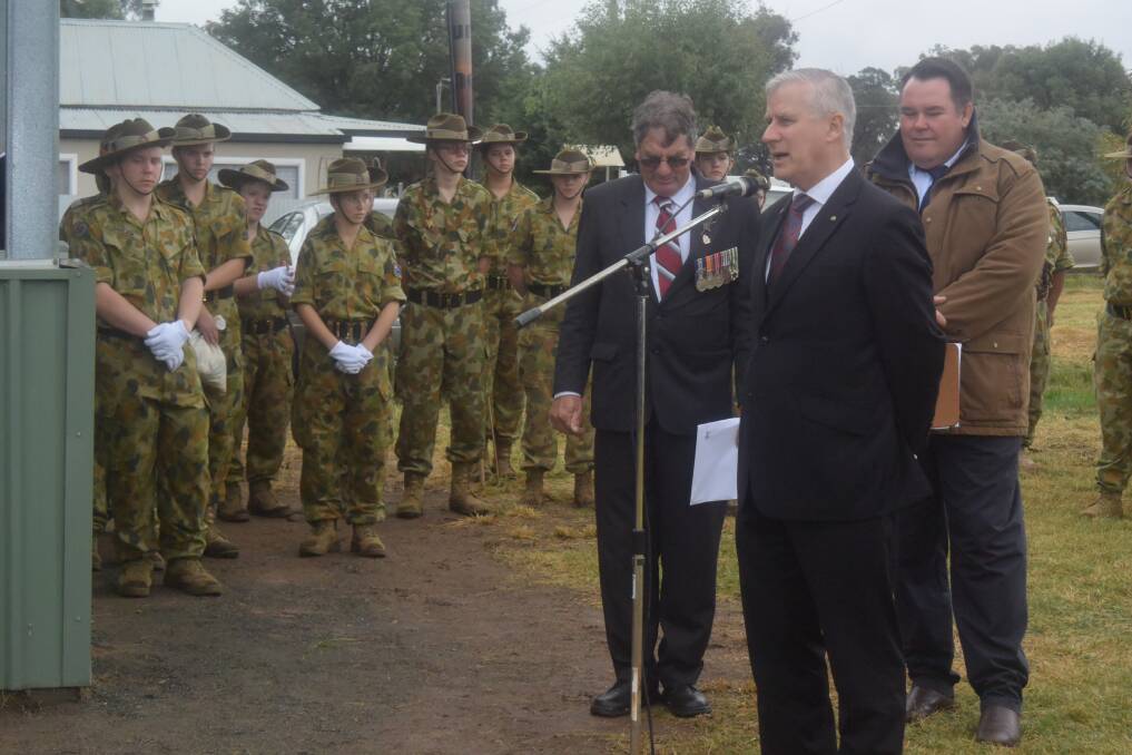 Member for Riverina Michael McCormack addresses the large crowd at the Bimbi Anzac Day Service along with MC Dom Nowlan and Mr Ken McAlister.