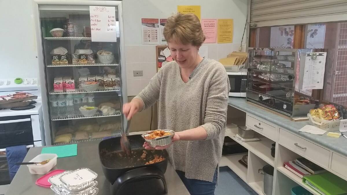 Canteen supervisor Mia Westman serving up a delicious meal for the students.