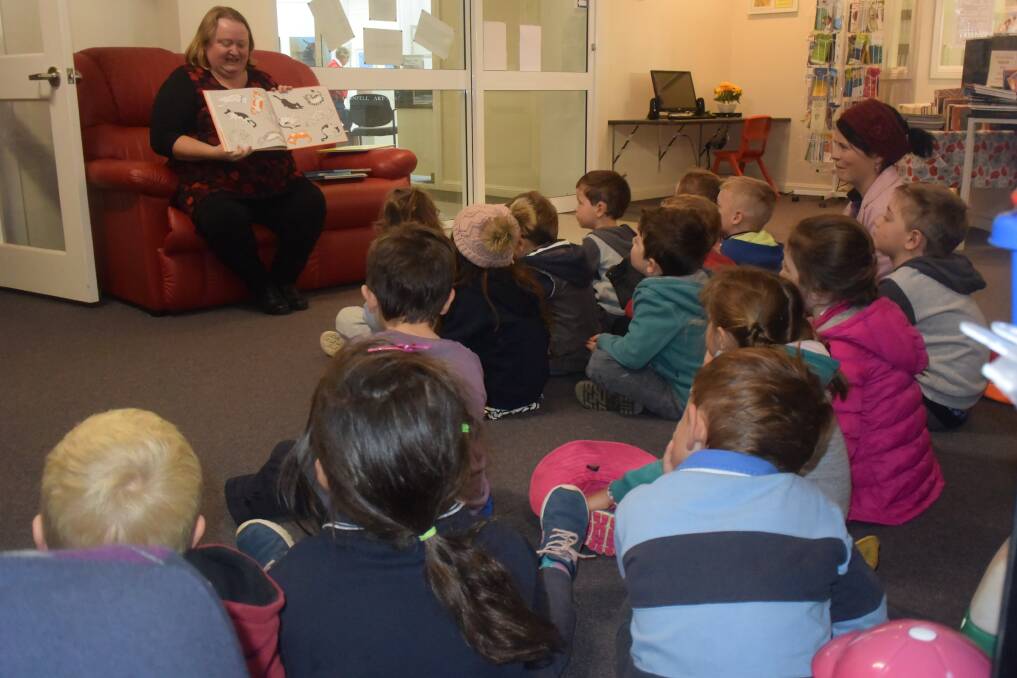 Grenfell Librarian Erica Kearnes reads to pre-schoolers during Australian Reading Hour. 