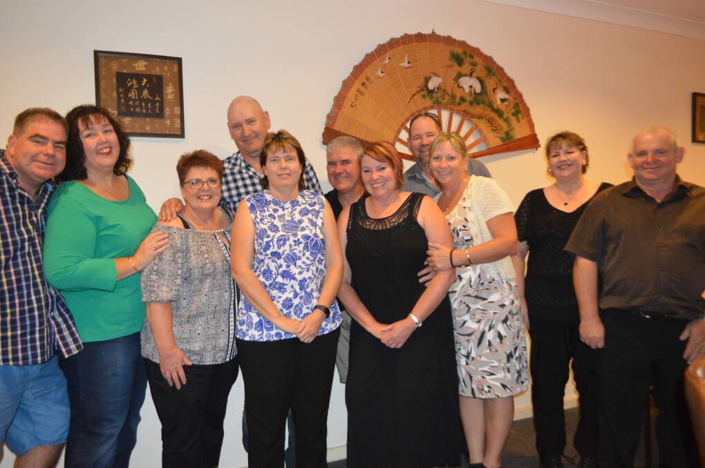 Leonie Wood (4th from L) and her husband Michael with family and friends at her 50th birthday celebration.

