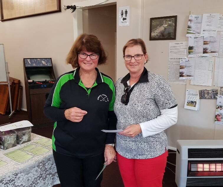 D Selwood (R) was winner of the A Grade Scratch event and is pictured receiving her award from Val Forsyth.