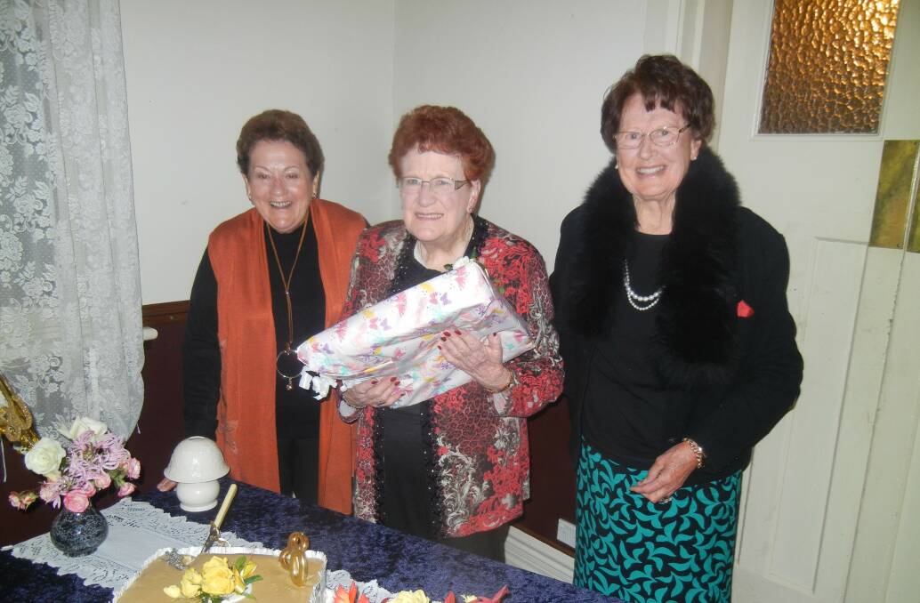 Robyn with great friends Pat Reid and Coral Mitton opening her present. 