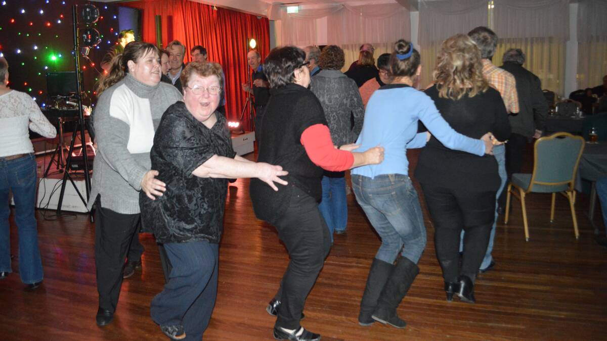The 'Conga Line' was a big hit at the 'Rock'N'Roll' night at the Bowling Club last Saturday, July 15.