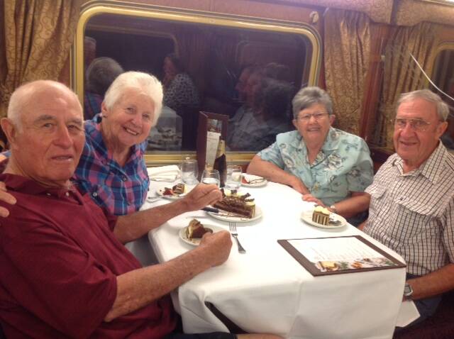 Graham and Margaret Spratt and Jill and Allan Hodgson in the Queen Adelaide dining car on board the Ghan. Contributed.