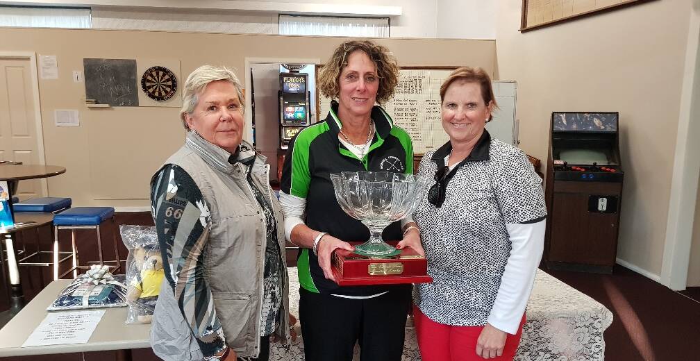 Glenda Cooper (B Grade), Jan Myers (A Grade) and D Selwood (C Grade) Stroke winners pictured here with the Val Lowe Memorial Trophy.