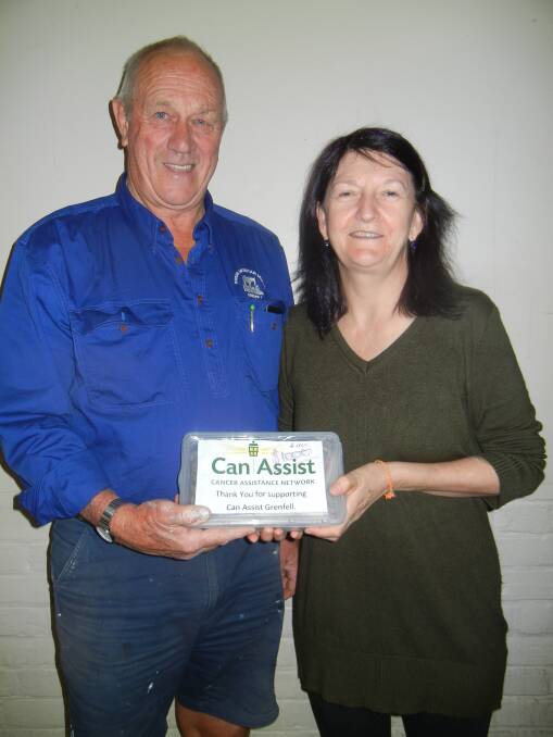  Don Robinson on behalf of the "Paint Girls" presenting a donation to Michelle Rohan (Can Assist).