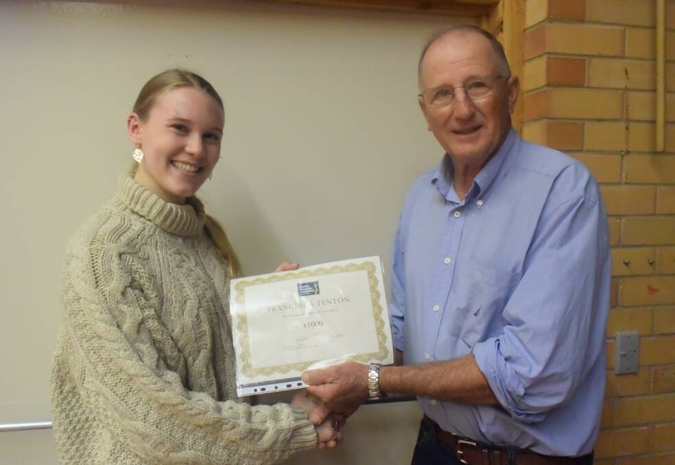 Chair of Grenfell CEF branch, Peter Spedding, presents Francesca Fenton with her scholarship funding of $1000.