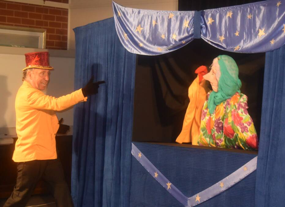 Steve Coupe from Sydney Puppet Theatre in a scene with Magica the puppet.

