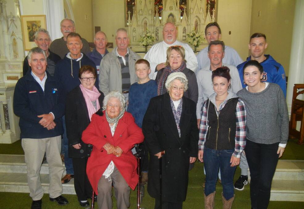 Mary Horder OAM, and her  younger sister Olive Quigley (93) from Trangie (seated) “Came Home to Grenfell” last weekend to celebrate Mary’s 95th birthday. Mary is pictured with family and Father Tom Thornton following mass.


