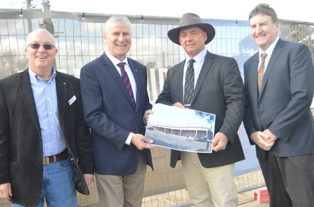 Grenfell Health Council Chair Peter Moffitt, Member for Riverina Michael McCormack, Weddin Shire mayor Mark Liebich and General Manager Glenn Carroll with an artists impression of the new Grenfell Medical Centre.