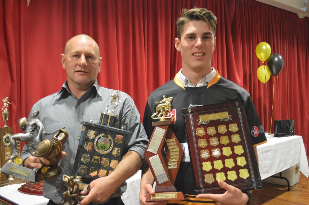 Mitchell Stevens (R) cleaned up at the awards night being presented with Best & Fairest, Rookie of the Year and Highest Point Scorer, Mitchell needed coach Mark Horne to help him hold all his trophies for the photo. 