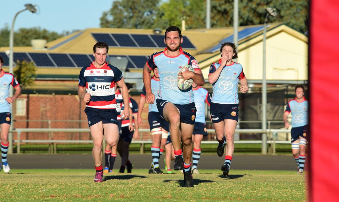 EASY: Billy Sing was all smiles on his way to the tryline for one of his three tries for the Dubbo Kangaroos during Saturday's mammoth win over Mudgee. Photo: BELINDA SOOLE