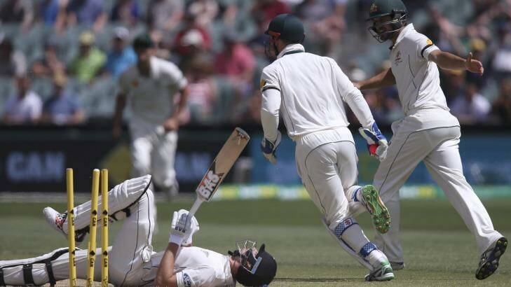 Down and out: New Zealand's Mitchell Santner lays on the ground after he was stumped by Peter Nevill. Photo: Rick Rycroft