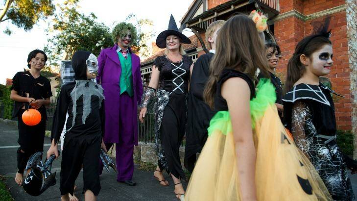 Brad and Phoebe Steyn go trick or treating with their children and others from their neighbourhood. Photo: Wolter Peeters