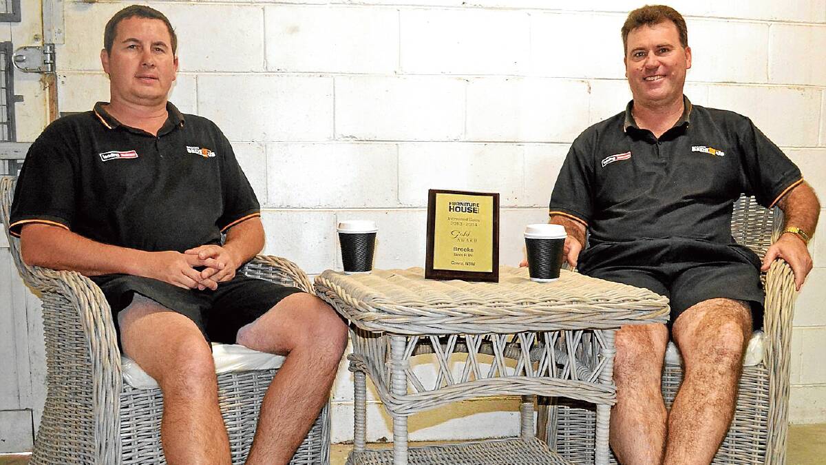 Brooks Bed r Us staff Jono Gee and Michael Brooks take a moment to relax after winning the Furniture House Group award for Increased Gold Sales recently.