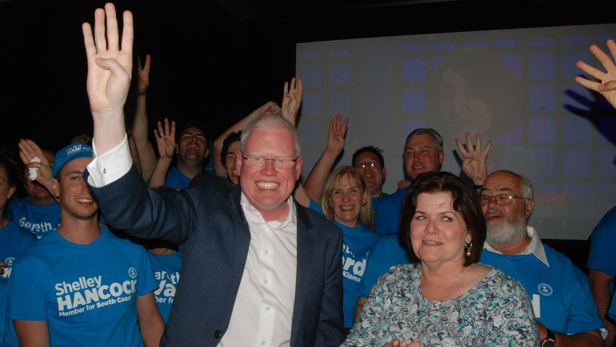 Surrounded by campaign workers, Gareth Ward and Shelley Hancock celebrate their win at the Bomaderry Bowling Club on Saturday night.