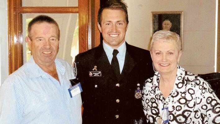 Simon Hill who graduated as a Protective Service Officer with the Australian Federal Police on December 19 with his parents David and Anne Hill. (Photo contributed) 