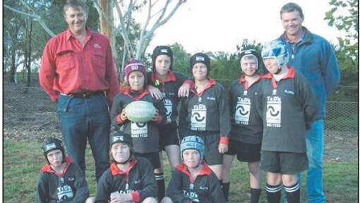 The mighty Grenfell U/10’s who played in front of the Brumbies in Canberra - Back row: Phil Peterson (coach), Will Peterson, Finlay Johnson, Henry Hunt, Angus Wickham, David Parsons, Matt Taylor (manager). Front row: Brock Taylor, Becky Eastaway, Dominic Fowler. 