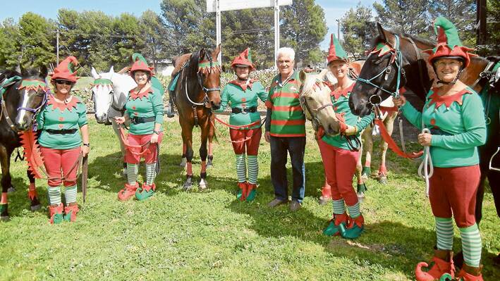 “The Elves” who won the Best Dressed Group in the Parade when the Weddin Mountain Muster did their ride through the Streets of Grenfell last week. They are pictured with another red and green ‘Rabbit’ imposter Terry Carroll at the morning tea at the Railway Station.
 
