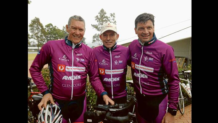Former Grenfell resident Wayne Heathcote (L) with the Prime Minister Tony Abbott and Local Member Angus Taylor following the 2014 Pollie Pedal Ride in support of Carers Australia. 