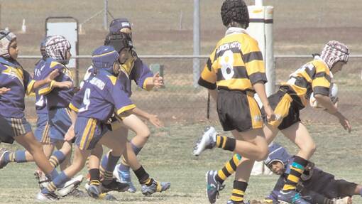 A Grenfell Junior League U/10's player reaches the try line in the season opener against Condobolin at Lawson Park. 