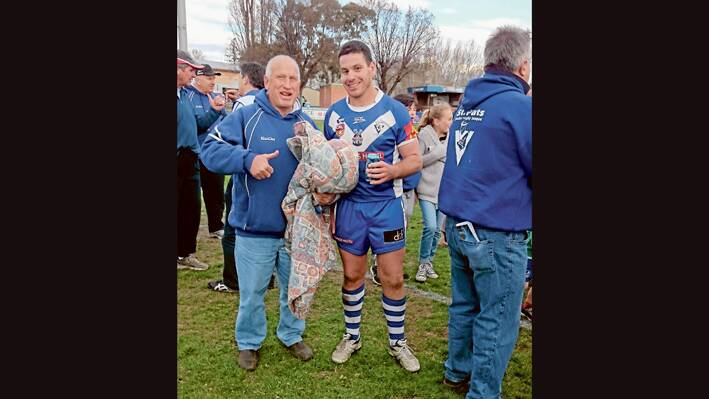What better way to celebrate Fathers day! Ian (Inky) Armstrong and son Michael celebrating Bathurst St Pats win over Mudgee Dragons 30 - 28 in a cliffhanger finish. (Contributed)
 