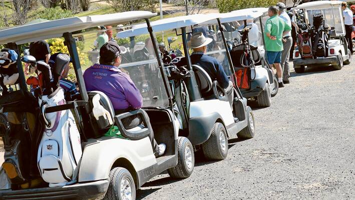 A line up of gold buggies at the Grenfell Golf Club during the recent NSW Sand Greens Tournament. 