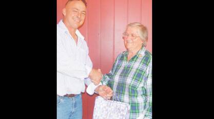 GRENFELL PAH&I SERVICE: Mark Leibich presenting Elaine Needham with a medallion recognising her 27 years as Society Secretary. 