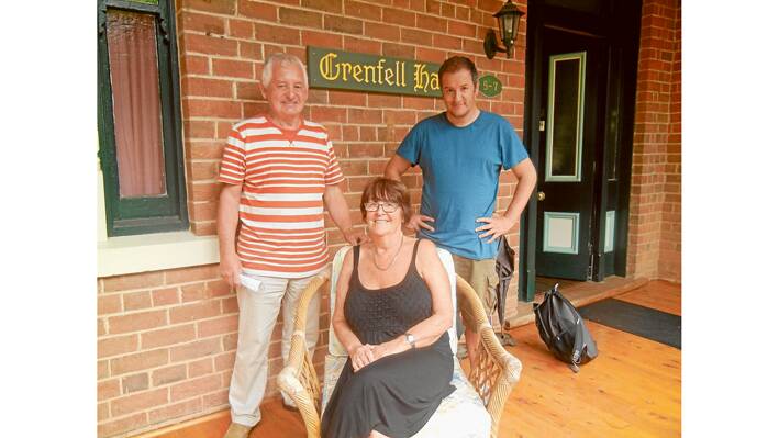 Jimmy Crossley a former Grenfellite (L) with his wife Ricky and their son Robert on the front porch of the historic Victorian Grenfell Hall in Weddin Street. 