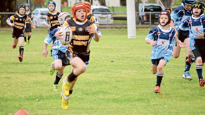 Grenfell u/10’s Junior League player Michael Smith on the burst for the tryline in a recent game against Parkes at Lawson Park. 
